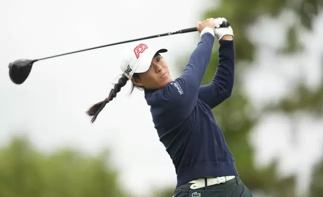 Celine Boutier of France watches her tee shot on the sixth hole during the third round of the LPGA Ladies Championship golf tournament at the Seowon Valley Country Club in Paju, South Korea, Saturday, Oct. 19, 2024. (AP Photo/Lee Jin-man)