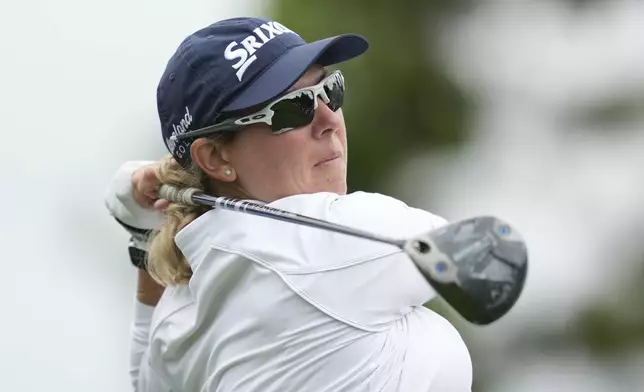 Ashleigh Buhai of South Africa watches her tee shot on the sixth hole during the third round of the LPGA Ladies Championship golf tournament at the Seowon Valley Country Club in Paju, South Korea, Saturday, Oct. 19, 2024. (AP Photo/Lee Jin-man)