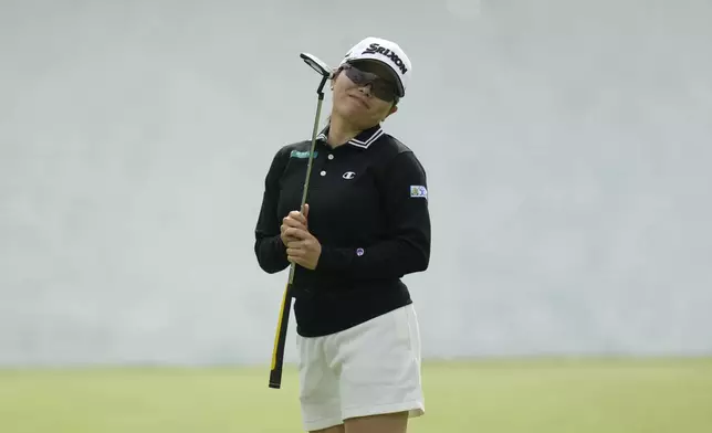 Minami Katsu of Japan reacts after missing a putt on the 5th green during the third round of the LPGA Ladies Championship golf tournament at the Seowon Valley Country Club in Paju, South Korea, Saturday, Oct. 19, 2024. (AP Photo/Lee Jin-man)