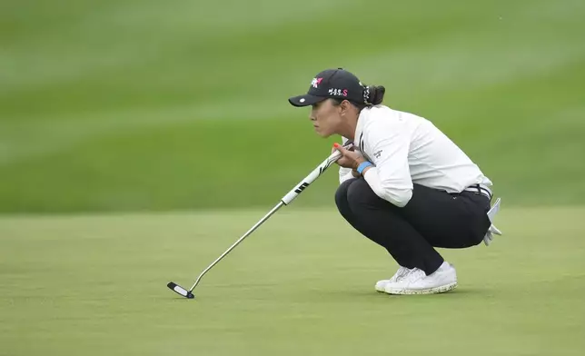 Amy Yang of South Korea lines up a putt on the fifth hole during the second round of the LPGA Ladies Championship golf tournament at the Seowon Valley Country Club in Paju, South Korea, Friday, Oct. 18, 2024. (AP Photo/Lee Jin-man)