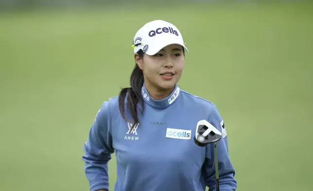 Yu Jin Sung of South Korea acknowledges the gallery on the 5th green during the third round of the LPGA Ladies Championship golf tournament at the Seowon Valley Country Club in Paju, South Korea, Saturday, Oct. 19, 2024. (AP Photo/Lee Jin-man)