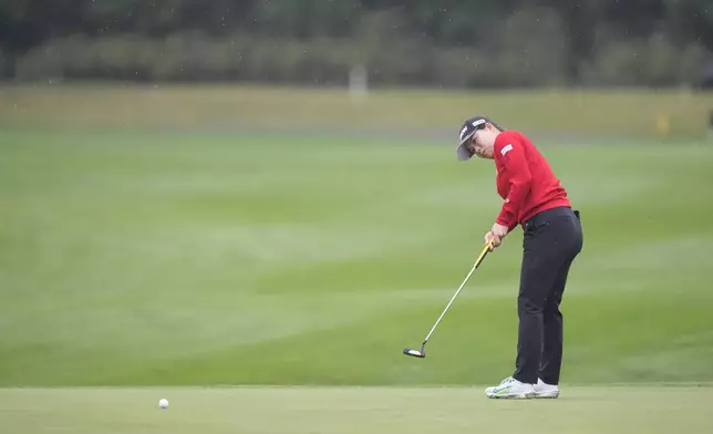 Minami Katsu of Japan putts on the fifth green during the second round of the LPGA Ladies Championship golf tournament at the Seowon Valley Country Club in Paju, South Korea, Friday, Oct. 18, 2024. (AP Photo/Lee Jin-man)