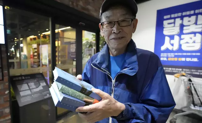 77-year-old South Korean Kim Hyung-duk poses after buying South Korean author Han Kang's books at a bookstore in Goyang, South Korea, Thursday, Oct. 10, 2024. (AP Photo/Lee Jin-man)