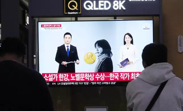 A TV screen shows an image of the winner of the 2024 Nobel Prize in Literature, South Korean writer Han Kang, during a news program at Seoul Railway Station in Seoul, South Korea, Thursday, Oct. 10, 2024. (AP Photo/Ahn Young-joon)