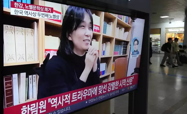 A TV screen shows an image of the winner of the 2024 Nobel Prize in Literature, South Korean writer Han Kang, during a news program at Seoul Railway Station in Seoul, South Korea, Thursday, Oct. 10, 2024. (AP Photo/Ahn Young-joon)