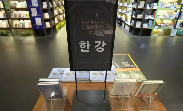 South Korean author Han Kang's books are displayed at a special section at a bookstore in Goyang, South Korea, Thursday, Oct. 10, 2024. The letters read "Han Kang, Awarded the Nobel Prize in literature." (AP Photo/Lee Jin-man)