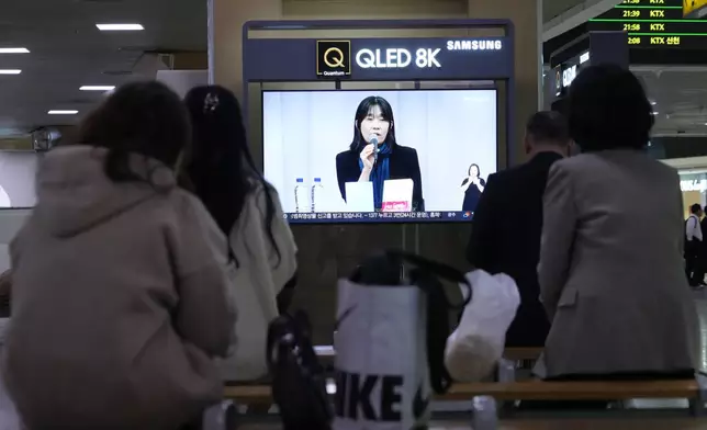 A TV screen shows a file image of the winner of the 2024 Nobel Prize in Literature, South Korean writer Han Kang, during a news program at Seoul Railway Station in Seoul, South Korea, Thursday, Oct. 10, 2024. (AP Photo/Ahn Young-joon)