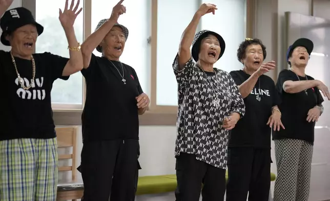 Members of Suni and the Seven Princesses rap inside a senior community center in Chilgok, South Korea, Thursday, Oct. 3, 2024. (AP Photo/Lee Jin-man)