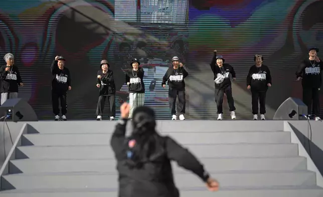 Members of Suni and the Seven Princesses rehearse for the opening event celebrating the heritage of the Korean alphabet, called "Hangeul," at Gwanghwamun square in Seoul, South Korea, Friday, Oct. 4, 2024. (AP Photo/Lee Jin-man)