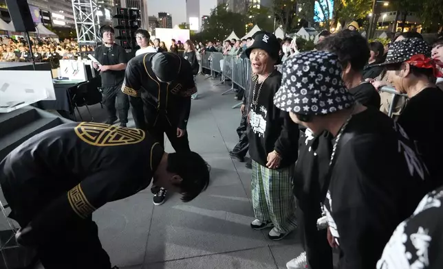 Young rappers bow in respect to members of Suni and the Seven Princesses after their performance during the opening ceremony of the Korean alphabet, "Hangeul Week" at Gwanghwamun square in Seoul, South Korea, Friday, Oct. 4, 2024. (AP Photo/Lee Jin-man)