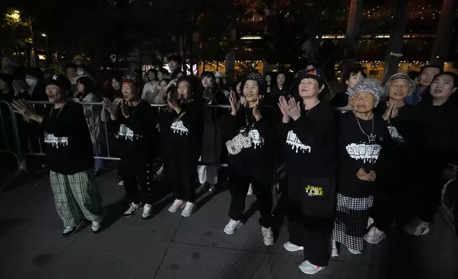 Members of Suni and the Seven Princesses, stand after their performance during the opening ceremony of the Korean alphabet, "Hangeul Week" at Gwanghwamun square in Seoul, South Korea, Friday, Oct. 4, 2024. (AP Photo/Lee Jin-man)