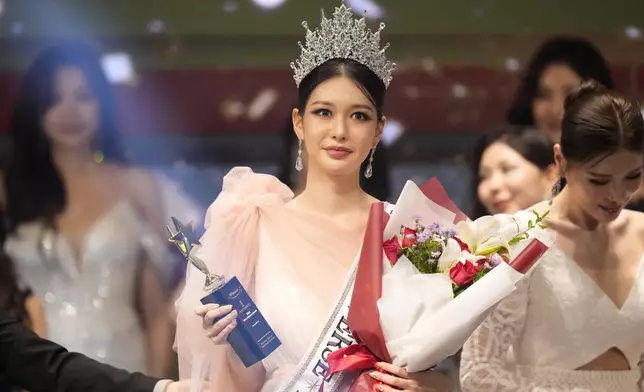 Han Ariel, a 22-year-old fashion school student, celebrates after winning the 2024 Miss Universe Korea in Seoul, South Korea, Monday, Sept. 30, 2024. (AP Photo/Lee Jin-man)