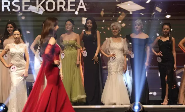 South Korean Choi Soon-hwa, 81-year-old, third from right, attends the 2024 Miss Universe Korea in Seoul, South Korea, Monday, Sept. 30, 2024. (AP Photo/Lee Jin-man)