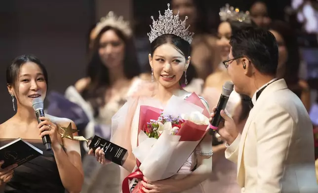 Han Ariel, a 22-year-old fashion school student, celebrates after winning the 2024 Miss Universe Korea in Seoul, South Korea, Monday, Sept. 30, 2024. (AP Photo/Lee Jin-man)