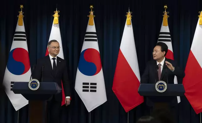 South Korean President Yoon Suk Yeol, right, and Poland's President Andrzej Duda, left, speak during a joint press conference at the Presidential Office in Seoul, South Korea, Thursday, Oct. 24, 2024. (Jeon Heon-Kyun/Pool Photo via AP)