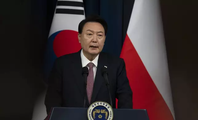 South Korean President Yoon Suk Yeol, speaks during a joint press conference with Poland's President Andrzej Duda, unseen, at the Presidential Office in Seoul, South Korea, Thursday, Oct. 24, 2024. (Jeon Heon-Kyun/Pool Photo via AP)