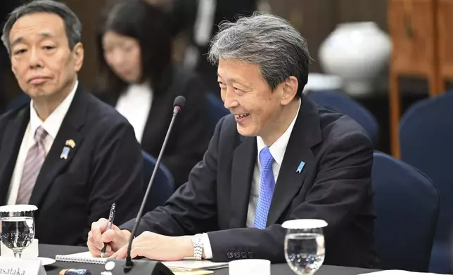 Japan's Vice Foreign Minister Masataka Okano, right, attends a trilateral meeting with South Korea's First Vice Foreign Minister Kim Hong-kyun, unseen, and United States Deputy Secretary of State Kurt Campbell, unseen, at the Foreign Ministry in Seoul Wednesday, Oct. 16, 2024. (Jung Yeon-je/Pool Photo via AP)