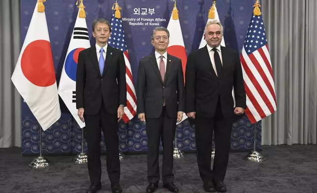 South Korea's First Vice Foreign Minister Kim Hong-kyun, center, poses for photos with United States Deputy Secretary of State Kurt Campbell, right, and Japan's Vice Foreign Minister Masataka Okano during their trilateral meeting at the Foreign Ministry in Seoul Wednesday, Oct. 16, 2024. (Jung Yeon-je/Pool Photo via AP)