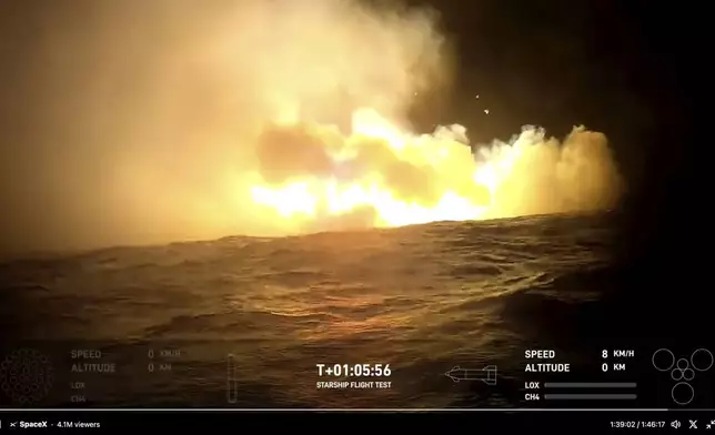 This image provided by SpaceX shows smoke and fire from SpaceX's mega Starship rocket after landing in the water in the Indian Ocean after returning during a test flight, Sunday, Oct. 13, 2024. (SpaceX via AP)