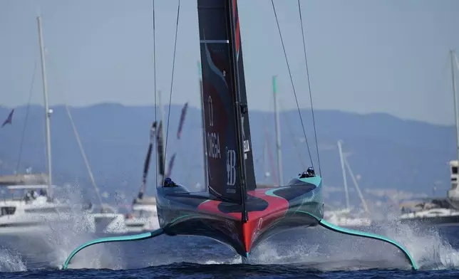 Emirates Team New Zealand races during the Louis Vuitton 37th America's Cup Day 6 race 9 in Barcelona, Spain, Saturday, Oct.19, 2024. (AP Photo/Bernat Armangue)