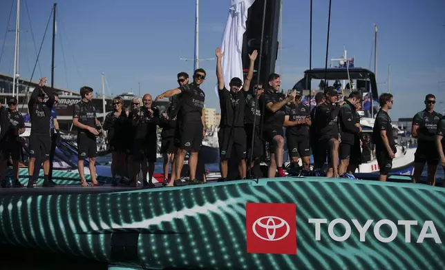 Emirates Team New Zealand crew celebrates as they won the Louis Vuitton 37th America's Cup in Barcelona, Spain, on Saturday, Oct. 19, 2024. (AP Photo/Emilio Morenatti)