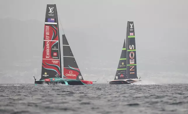 Ineos Britannia and Emirates Team New Zealand warm-up for the Louis Vuitton 37th America's Cup Day 3 race 4 in Barcelona, Spain, Monday, Oct. 14, 2024. (AP Photo/Bernat Armangue)