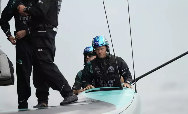 Emirates Team New Zealand crew prepares for the Louis Vuitton 37th America's Cup race in Barcelona, Spain, Saturday, Oct. 12, 2024. (AP Photo/Bernat Armangue)