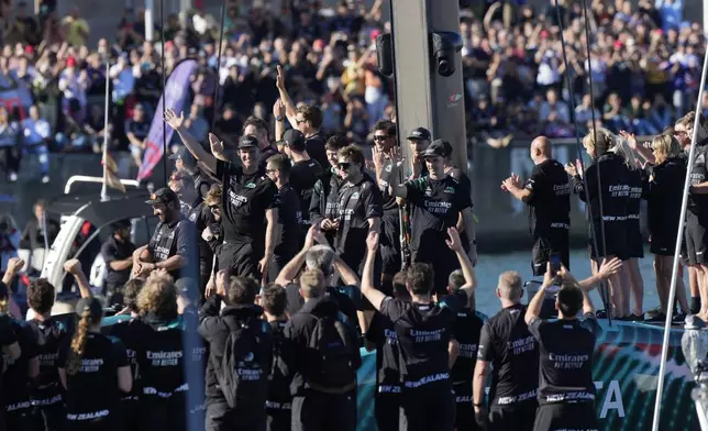 Emirates Team New Zealand crew celebrates after winning the Louis Vuitton 37th America's Cup in Barcelona, Spain, Saturday, Oct.19, 2024. (AP Photo/Bernat Armangue)