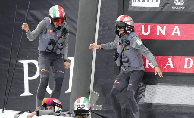 Luna Rossa Prada Pirelli's team celebrates after winning the Puig Women's America's Cup race in Barcelona, Spain, Saturday, Oct. 12, 2024. (AP Photo/Bernat Armangue)