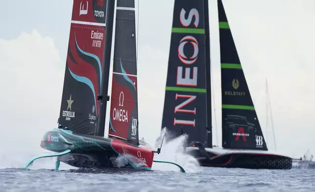 Ineos Britannia and Emirates Team New Zealand race during Louis Vuitton 37th America's Cup Day 5 race 7 in Barcelona, Spain, Friday, Oct. 18, 2024. (AP Photo/Bernat Armangue)