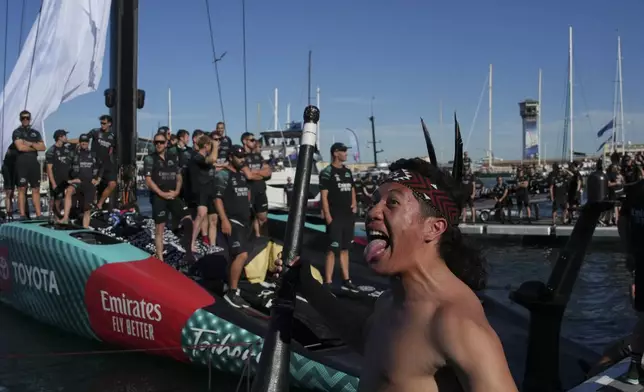 Emirates Team New Zealand crew celebrates as they won the Louis Vuitton 37th America's Cup in Barcelona, Spain, on Saturday, Oct. 19, 2024. (AP Photo/Emilio Morenatti)