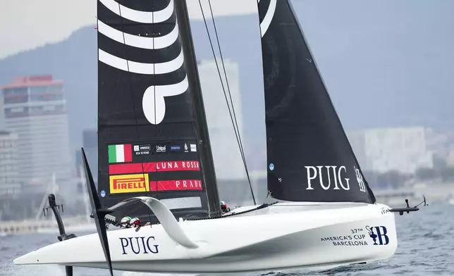 Luna Rossa Prada Pirelli's team races during the Puig Womne's America's Cup race in Barcelona, Spain, Saturday, Oct. 12, 2024. (AP Photo/Bernat Armangue)