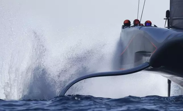 Ineos Britannia crosses the finish line as they win the race 5 of the Louis Vuitton 37th America's Cup Day 4, in Barcelona, Spain, Wednesday, Oct. 16, 2024. (AP Photo/Bernat Armangue)