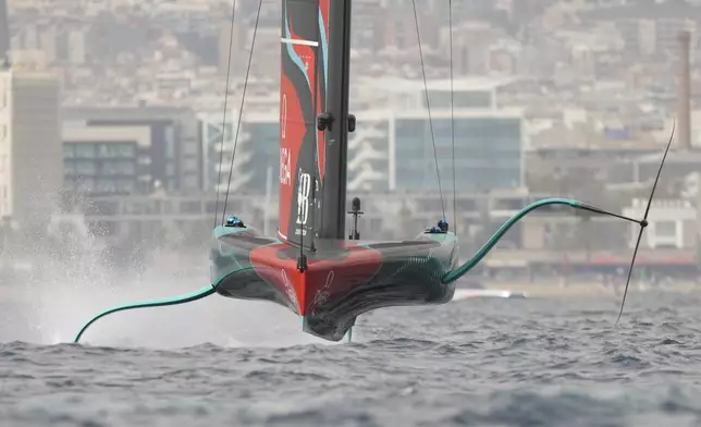 Emirates Team New Zealand crew races duringthe Louis Vuitton 37th America's Cup Day 3 race 4 in Barcelona, Spain, on Monday, Oct. 14, 2024. (AP Photo/Bernat Armangue)