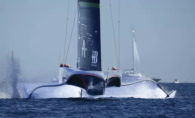 Ineos Britannia warms up for the Louis Vuitton 37th America's Cup Day 6 race 9 in Barcelona, Spain, Saturday, Oct.19, 2024. (AP Photo/Bernat Armangue)