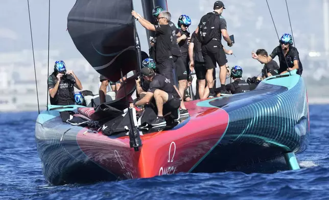 Emirates Team New Zealand crew prepares for the Louis Vuitton 37th America's Cup Day 4 race 5 in Barcelona, Spain, Wednesday, Oct. 16, 2024. (AP Photo/Bernat Armangue)