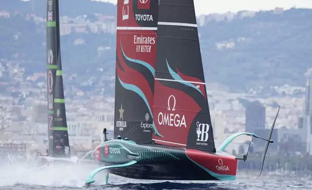 Ineos Britannia and Emirates Team New Zealand race during Louis Vuitton 37th America's Cup Day 5 race 8 in Barcelona, Spain, Friday, Oct. 18, 2024. (AP Photo/Bernat Armangue)