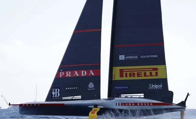 Luna Rosa Prada Pirelli sailing team competes during the Louis Vuitton Cup Final Day 7 at the Barcelona's coast, Spain, Friday, Oct. 4, 2024. (AP Photo/Joan Monfort)