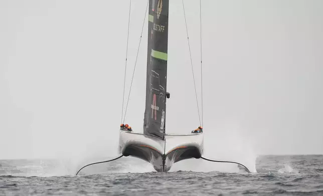 Ineos Britannia crew warms up for the Louis Vuitton 37th America's Cup Day 3 race 4 in Barcelona, Spain, on Monday, Oct. 14, 2024. (AP Photo/Bernat Armangue)