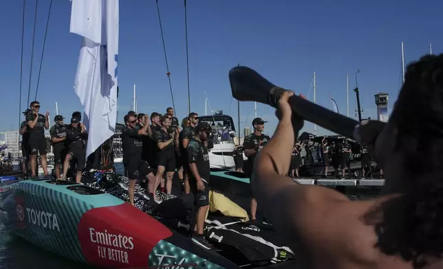 Emirates Team New Zealand crew celebrates as they won the Louis Vuitton 37th America's Cup in Barcelona, Spain, on Saturday, Oct. 19, 2024. (AP Photo/Emilio Morenatti)