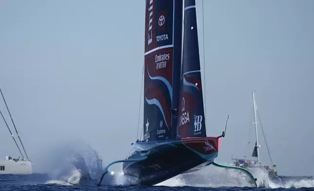 Emirates Team New Zealand races during the Louis Vuitton 37th America's Cup Day 6 race 9 in Barcelona, Spain, Saturday, Oct.19, 2024. (AP Photo/Bernat Armangue)