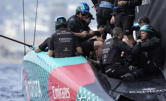 Emirates Team New Zealand crew prepares for the Louis Vuitton 37th America's Cup Day 3 race in Barcelona, Spain, Friday, Oct. 18, 2024. (AP Photo/Bernat Armangue)