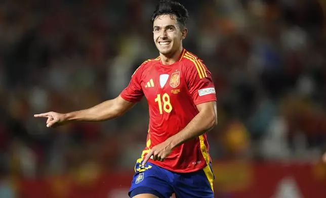 Spain's Martín Zubimendi celebrates after scoring the opening goal during the UEFA Nations League group 4 soccer match between Spain and Denmark in Murcia, Spain, Saturday, Oct. 12, 2024. (AP Photo/Jose Breton)