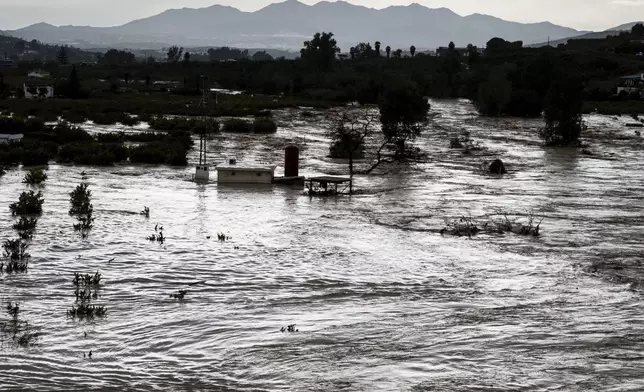 A view of the rising river, after floods preceded by heavy rains caused the river to overflow its banks in the town of Alora, Malaga, Spain, Tuesday, Oct. 29, 2024. (AP Photo/Gregorio Marrero)