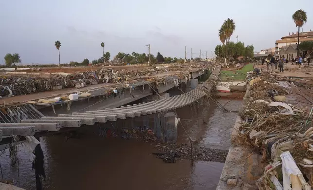 Train tracks are seen affected by floods in Paiporta, near Valencia, Spain, Wednesday, Oct. 30, 2024. (AP Photo/Alberto Saiz)