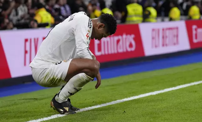 Real Madrid's Jude Bellingham is dejected after a Spanish La Liga soccer match between Real Madrid and Barcelona at the Santiago Bernabeu stadium in Madrid, Spain, Saturday, Oct. 26, 2024. (AP Photo/Manu Fernandez)