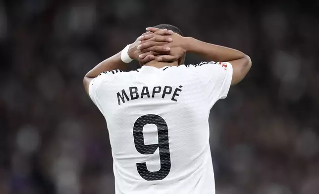 Real Madrid's Kylian Mbappe reacts during a Spanish La Liga soccer match between Real Madrid and Barcelona at the Santiago Bernabeu stadium in Madrid, Spain, Saturday, Oct. 26, 2024. (AP Photo/Bernat Armangue)