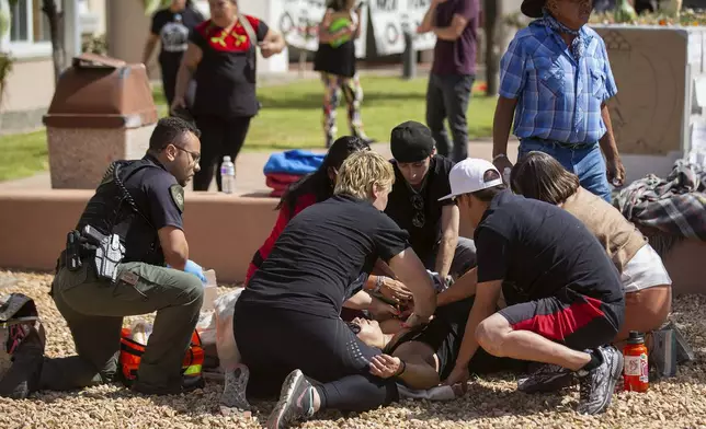 FILE - Activists tend to a shooting victim during a protest where officials had planned to install a statue of Spanish conquistador Juan de Oñate Thursday, Sept. 28, 2023, in Española, N.M. (Luis Sanchez Saturno/Santa Fe New Mexican via AP, File)