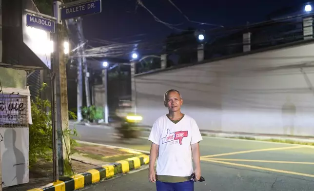 Roberto Perez, a 53-year-old who works part-time near Balete Drive, is seen here in Quezon City, Philippines, Friday, Oct. 25, 2024. (AP Photo/Aaron Favila)