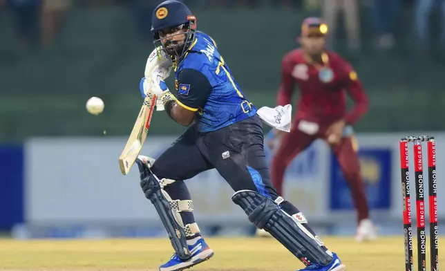 Sri Lanka's Captain Charith Asalanka plays a shot during the first ODI cricket match between Sri Lanka and West Indies in Pallekele, Sri Lanka, Sunday, Oct. 20, 2024. (AP Photo/Viraj Kothalawala)